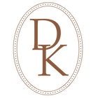 Logo with the initials 'DK' in an oval frame on a white background. Dovie Kate Icon Logo